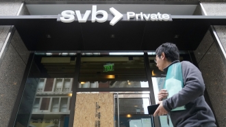 A pedestrian passes a Silicon Valley Bank branch in San Francisco
