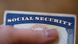 A person holds a social security card
