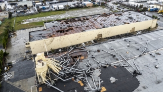 Damage to a building is seen after a tornado.