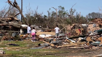 Piles of debris lay from tornado damage in Rolling Fork, Mississippi.