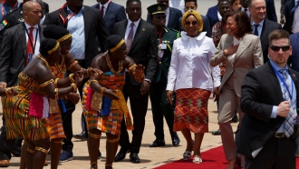 U.S. Vice President Kamala Harris is greeted by traditional dancers as she arrives in Accra, Ghana.