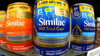 Similac infant formula on display on a store shelf.