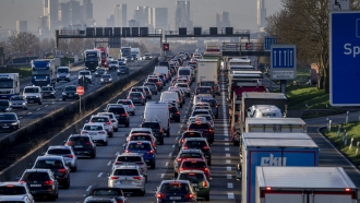 Cars and trucks queue in a traffic jam on a highway near Frankfurt, Germany,