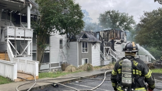 Firefighters battle a large apartment fire in South Carolina Friday.
