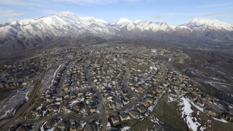 Rows of homes in suburban Salt Lake City seen from above.