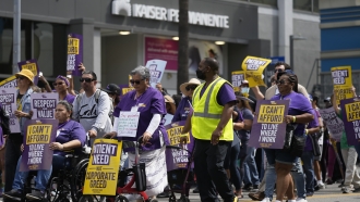 Frontline healthcare workers marching