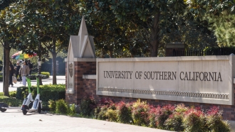 The name for the University of Southern California is displayed at a campus entrance.