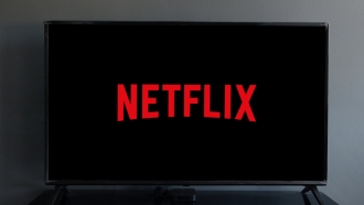 The Netflix logo appears on a tlevision.