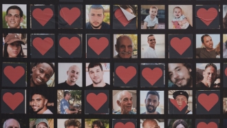 A wall with photographs of hostages who were kidnapped during the Oct. 7 Hamas cross-border attack in Israel .