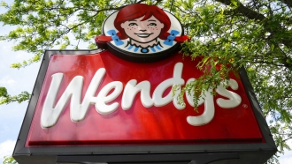 A Wendy's restaurant sign is shown.