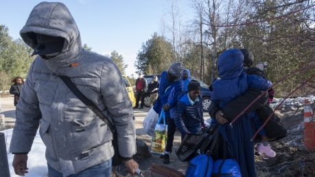Asylum seekers cross the border at Roxham Road from New York into Canada.