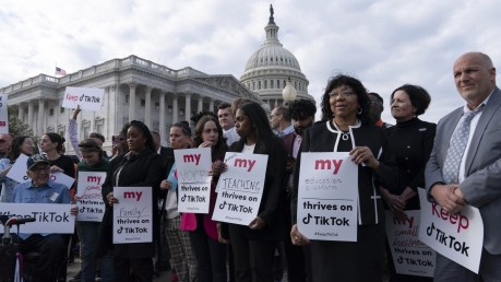 Supporters of TikTok hold signs during a rally to defend the app, Wednesday, March 22, 2023, at the Capitol in Washington.