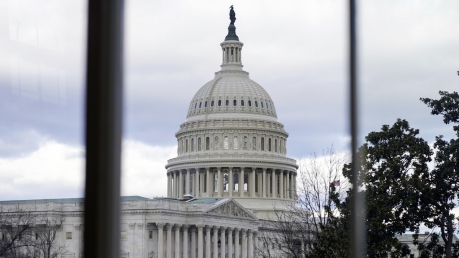 The U.S Capitol photographed through a House Cannon building window on Wednesday, Jan. 10, 2024, in Washington.