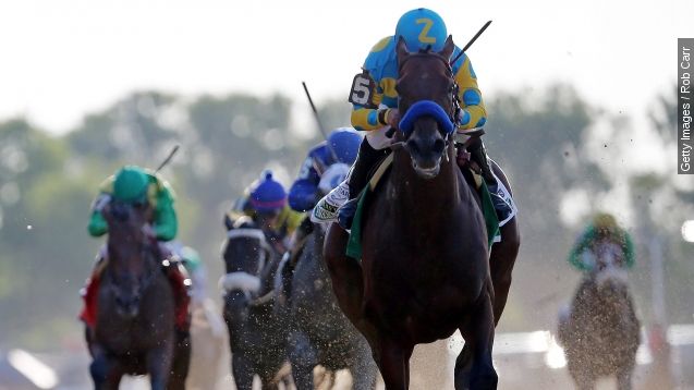 American Pharoah #5, ridden by Victor Espinoza, crosses the finish line ahead of Frosted #6, ridden by Joel Rosario, and Keen Ice #7, ridden by Kent Desormeaux, to win the 147th running of the Belmont Stakes at Belmont Park on June 6, 2015 in Elmont, New York.