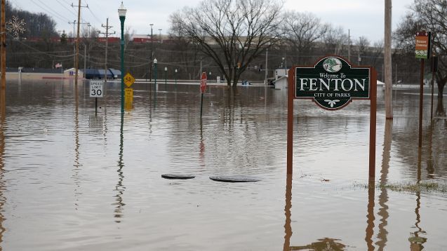 Gravois Road is seen fully submerged on December 30, 2015 in Fenton, Missouri. The St. Louis area and surrounding region experiencing record flood crests of the Mississippi, Missouri and Meremac Rivers after days of record rainfall.