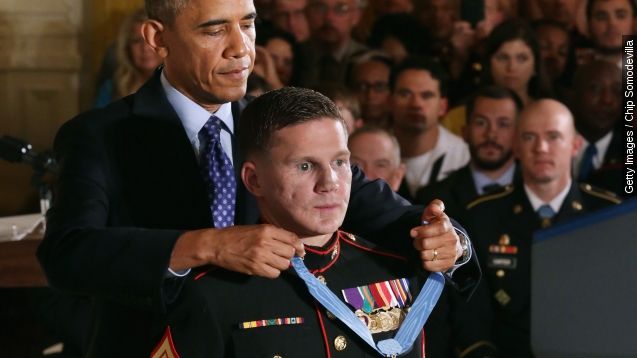 Retired Marine Corporal William Kyle Carpenter receives the Medal of Honor from President Obama.
