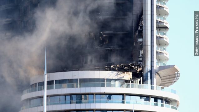 The Address Downtown Hotel is surrounded by smoke early on January 1, 2016 in Dubai, United Arab Emirates.