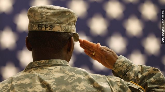 A U.S. serviceman salutes the flag