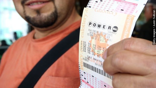 Angel Roblero holds a Powerball ticket that he just purchased on May 17, 2013 in San Francisco, California.