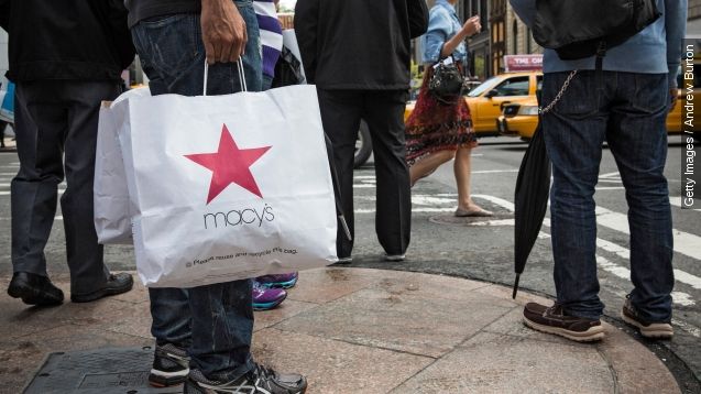 A shopper walks through Herald Square, outside Macy's on 34th Street on May 1, 2014 in New York City.