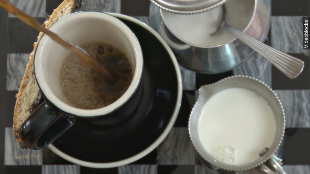 Stock footage from Videoblocks of pouring coffee into a cup.