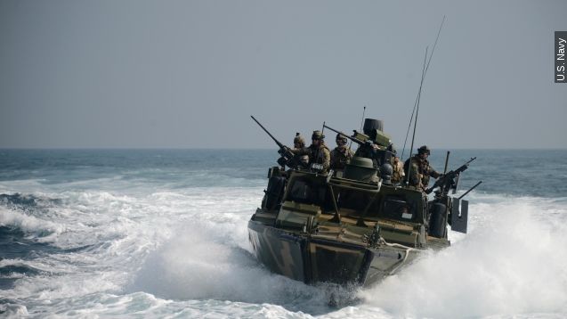 Sailors on a riverine command boat in 2014.