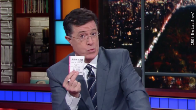 Stephen Colbert holds up his Powerball ticket on "The Late Show."