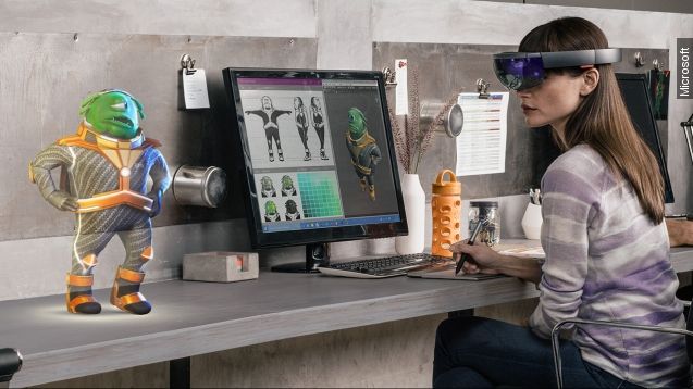 A woman uses the Microsoft HoloLens to sketch a 3-D figurine.