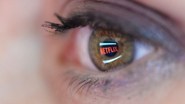 In this photo illustration the Netflix logo is reflected in the eye of a woman on September 19, 2014 in Paris, France.