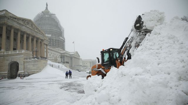 A bulldozer clears snow in Washington, DC.