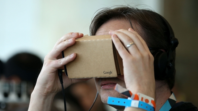 An attendee inspects Google Cardboard during the 2015 Google I/O conference on May 28, 2015 in San Francisco, California.