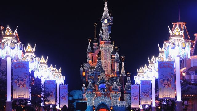 Disneyland Paris lit up at night.