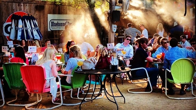 People sit on the patio of the Katy Trail Ice House in Dallas, Texas.