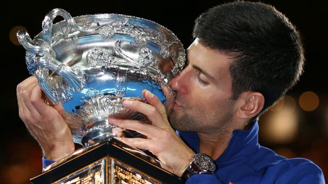 Novak Djokovic of Serbia kisses the Norman Brookes Challenge Cup after winning the Men's Singles Final over Andy Murray of Great Britain during day 14 of the 2016 Australian Open at Melbourne Park on January 31, 2016 in Melbourne, Australia.