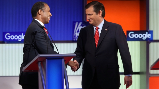 Ted Cruz and Ben Carson shake hands.