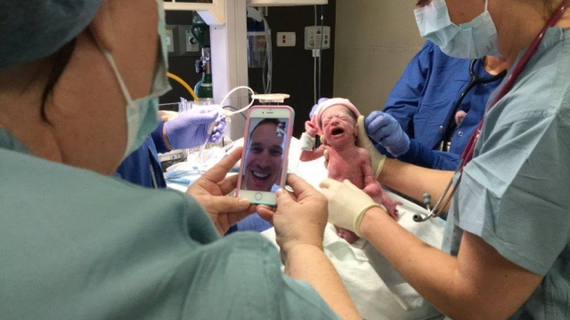 Photo of Tony Burch witnessing the birth of his children on FaceTime.