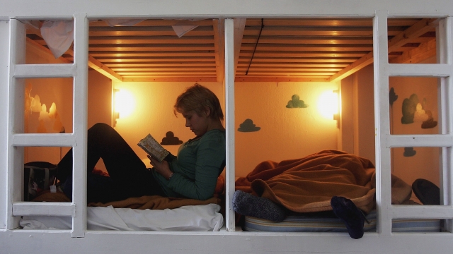 LONDON - MARCH 05: A woman sits in her pod-bed dorm room at Piccadilly Backpackers on March 5, 2006 in London, England.