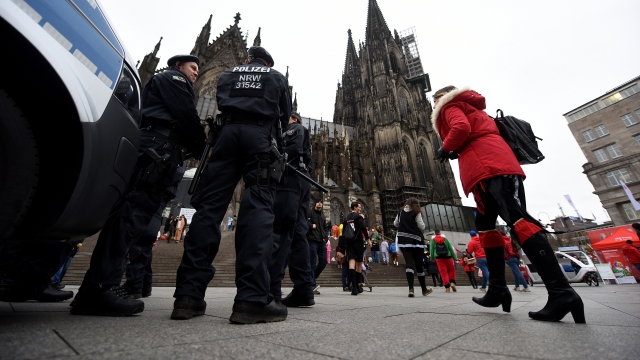Policeman are placed in front of Cologne Central Station during Weiberfastnacht celebrations as part of the carnival season on February 4, 2016 in Cologne, Germany.