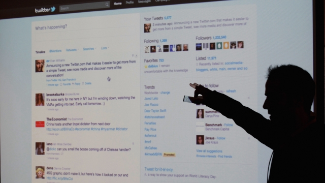 Twitter CEO Evan Williams is seen silhouetted against a screen as he shows off the newly revamped Twitter website on September 14, 2010 at Twitter headquarters in San Francisco, California.
