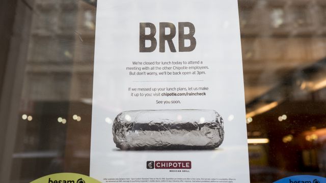 A sign sits in the window of a Chipotle restaurant on Broadway in Lower Manhattan telling customers the restaurant is closed until 3 p.m. on February 8, 2016 in New York City. The Mexican food chain is closing stores for lunch nationwide for a meeting on food safety following a number of E. coli outbreaks.