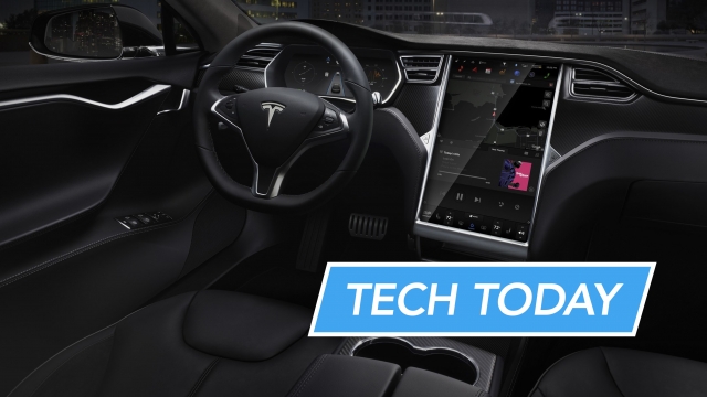 A Tesla vehicle's interior is shown with the console's display activated.