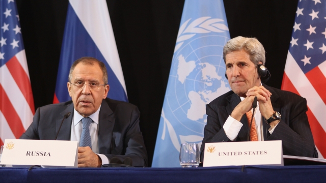 U.S. Secretary of State John Kerry (R) listens to Russian Foreign Minister Sergey Lavrov during a press conference following a meeting of the International Syrian Support Group.