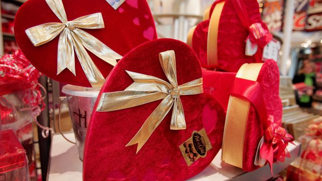 Heart-shaped boxes of chocolate are displayed.
