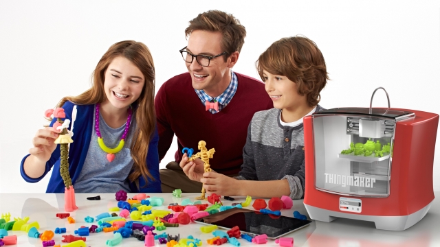 A family plays with toys made by Mattel's ThingMaker.