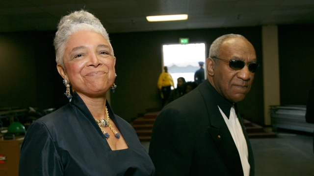Bill Cosby and wife Camille Cosby walk backstage during the 38th annual NAACP Image Awards