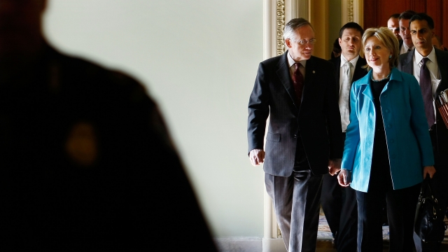 Clinton and Reid walk together