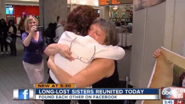 Sisters Karen Hill and Deb Myers hug at the airport
