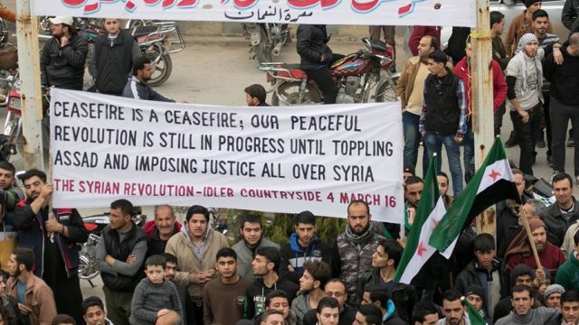 Protests erupted in the streets of cities under rebel control after a cease-fire put an end to bombings in Syria.
