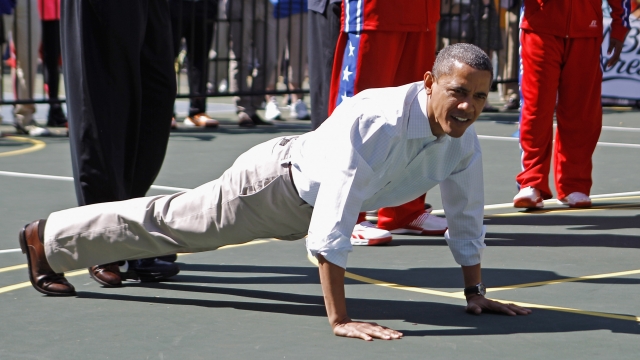 President Barack Obama does pushups.