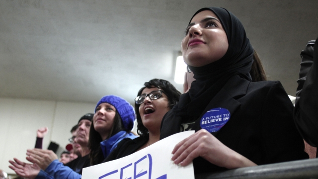 Voters in Dearborn, Michigan listen to Bernie Sanders at a rally.